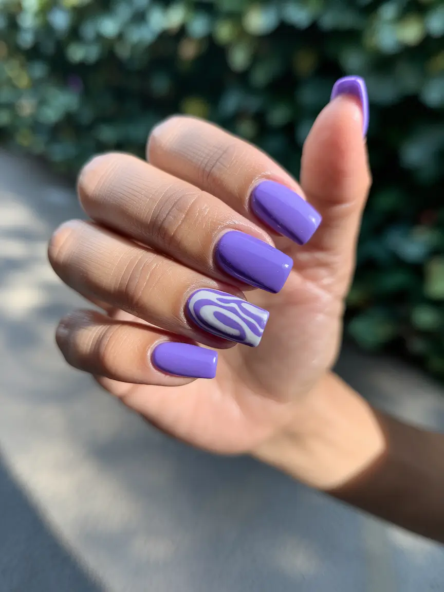 Fresh Nail Ideas to Try This May 2025 Groovy Purple Swirls with a Graphic Edge