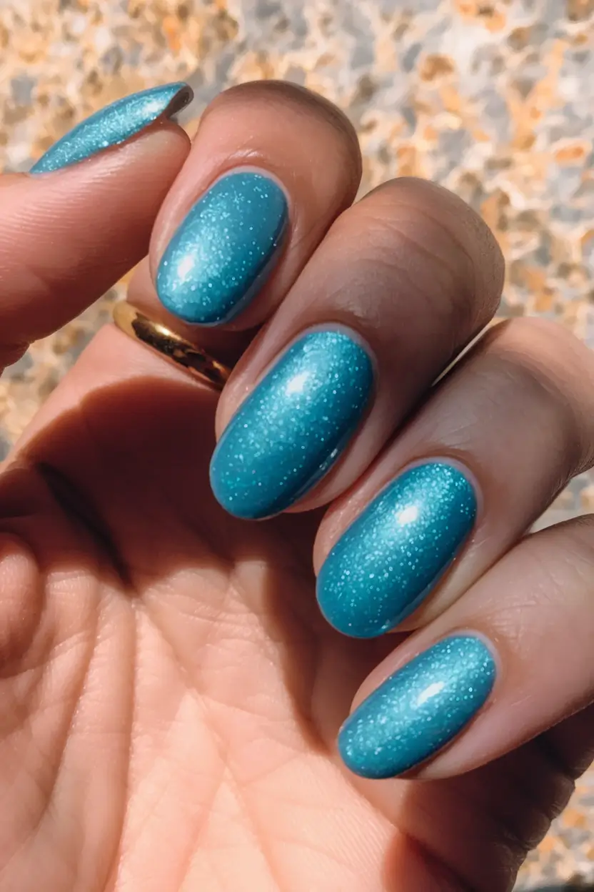 Glossy Gel Nails for Summer 2025 Ocean Blue Sparkle
