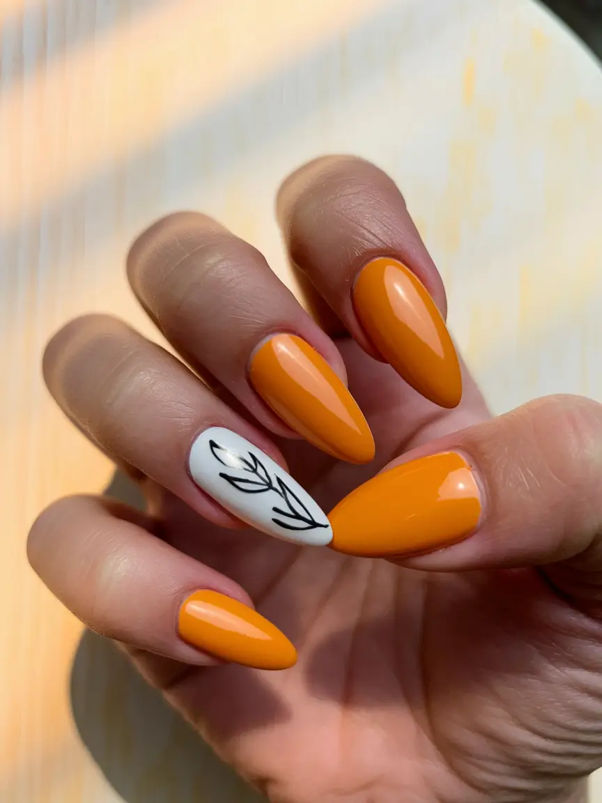 Prettiest May Colors for 2025 Nails+Bold Orange with Minimalist Leaf Accent