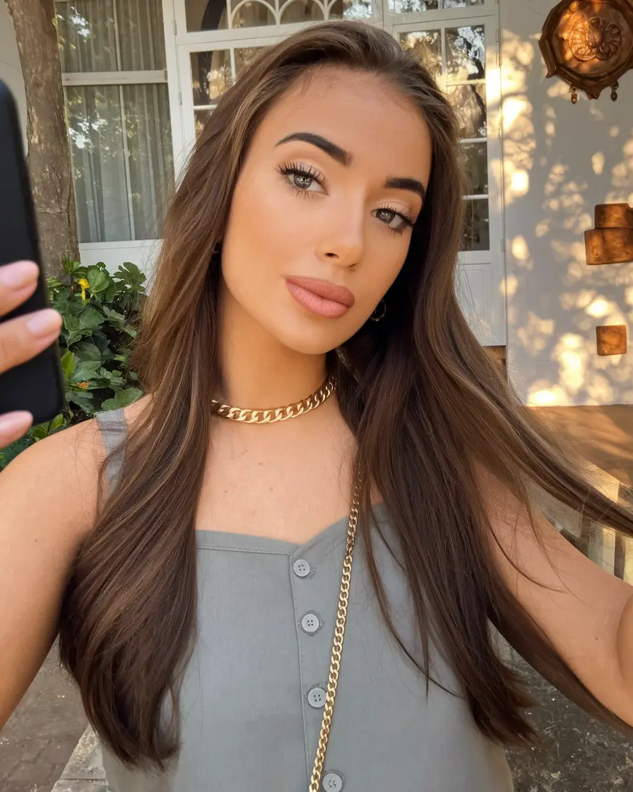 2025 Fall Hair Color Trends for Latina Women Classic Glossy Chestnut with Natural Texture