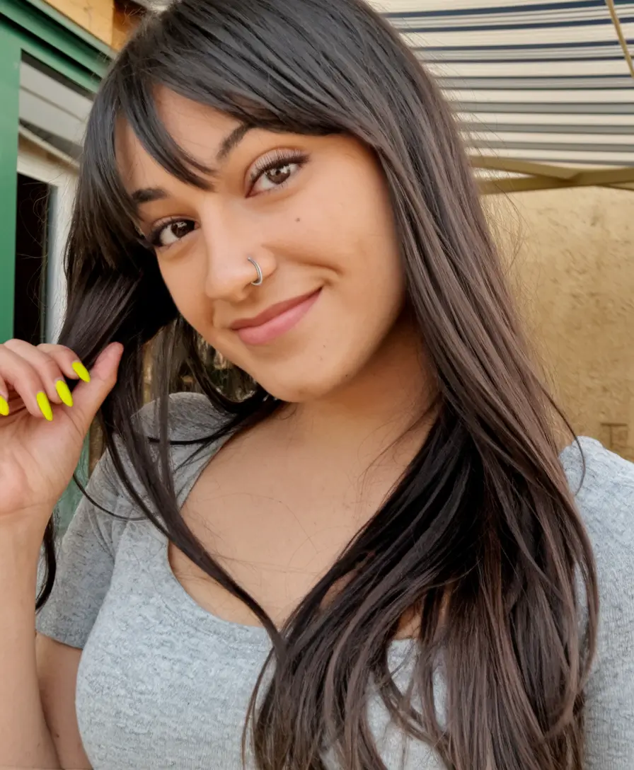 2025 Fall Hair Color Trends for Latina Women Cool Black-Brown with Baby Bangs