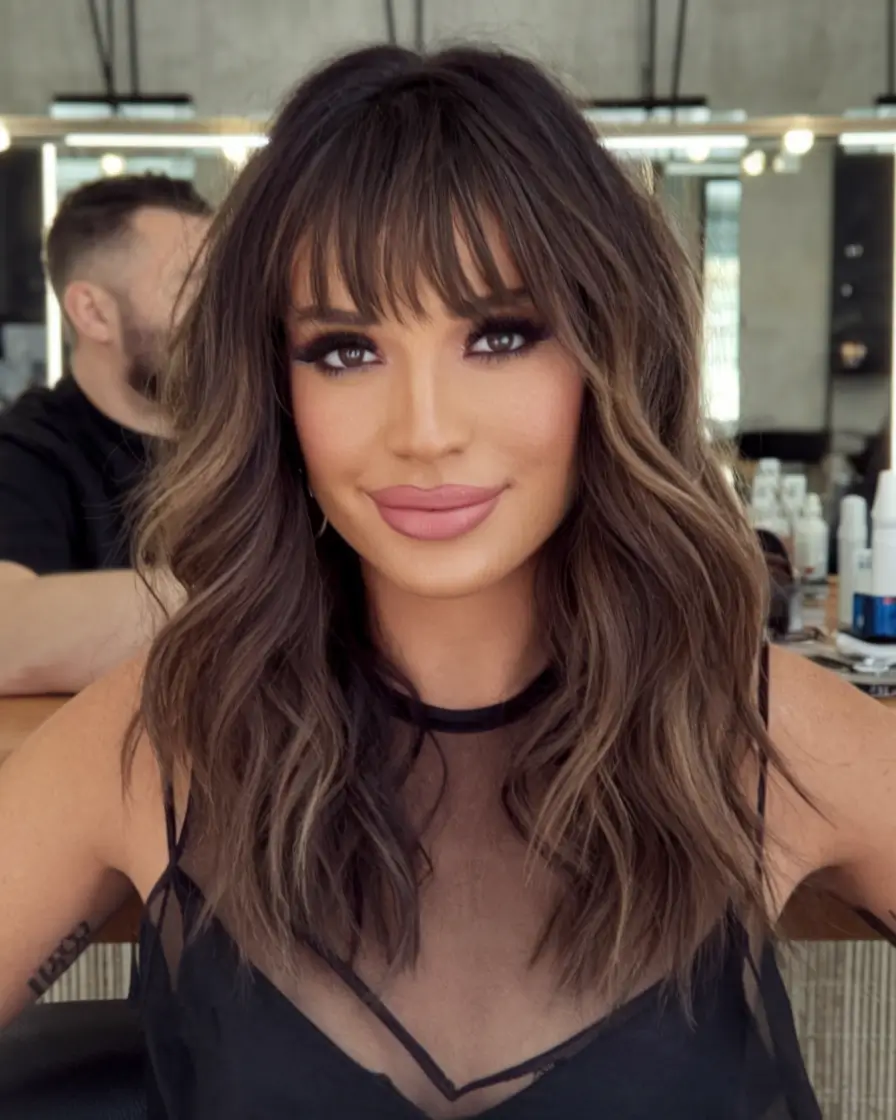 2025 Fall Hair Color Trends for Latina Women Bronze Brunette with Tousled Mid-Length Cut