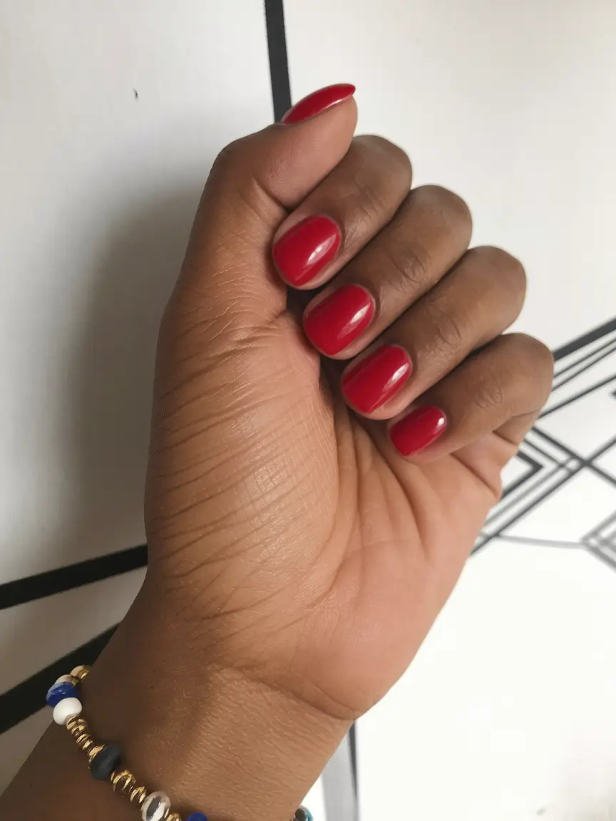 Fall 2025 Nail Colors for Brown Skin Classic Red With a Creamy Twist