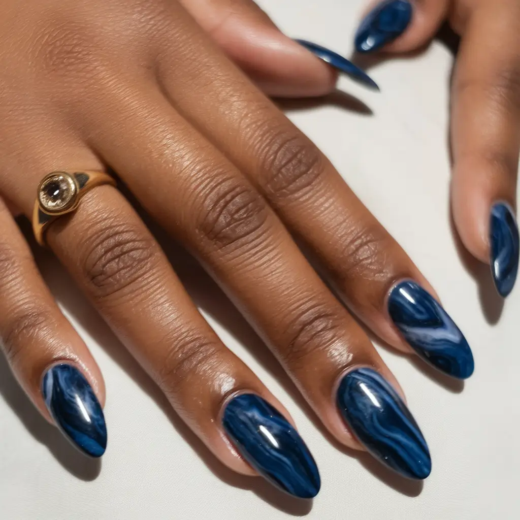 Fall 2025 Nail Colors for Brown Skin Midnight Swirl in Ocean Blue