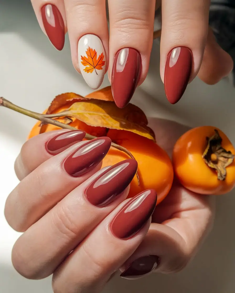 Autumn 2025 Nail Design Ideas Rust Red Almond with Maple Detail