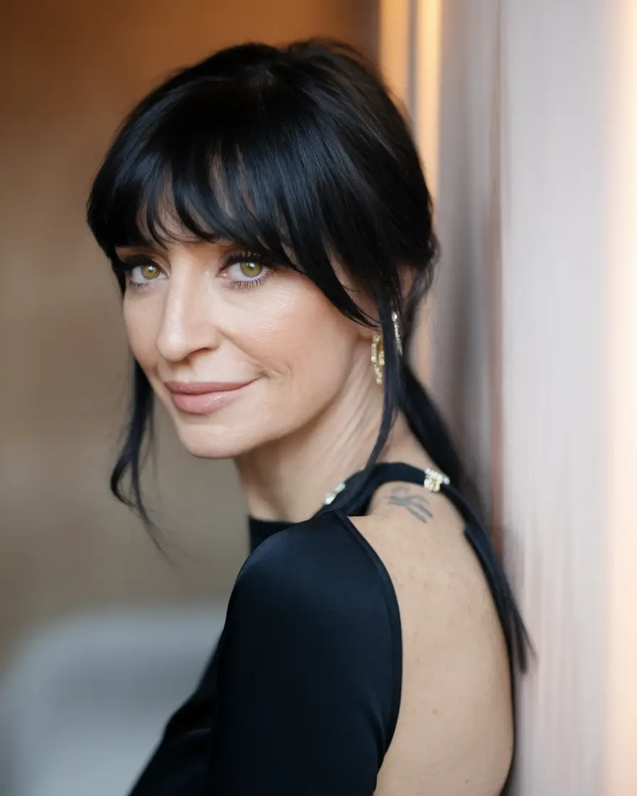 Fall hairstyles for women over 40 ideas 2025 Wispy Ponytail with Bangs
