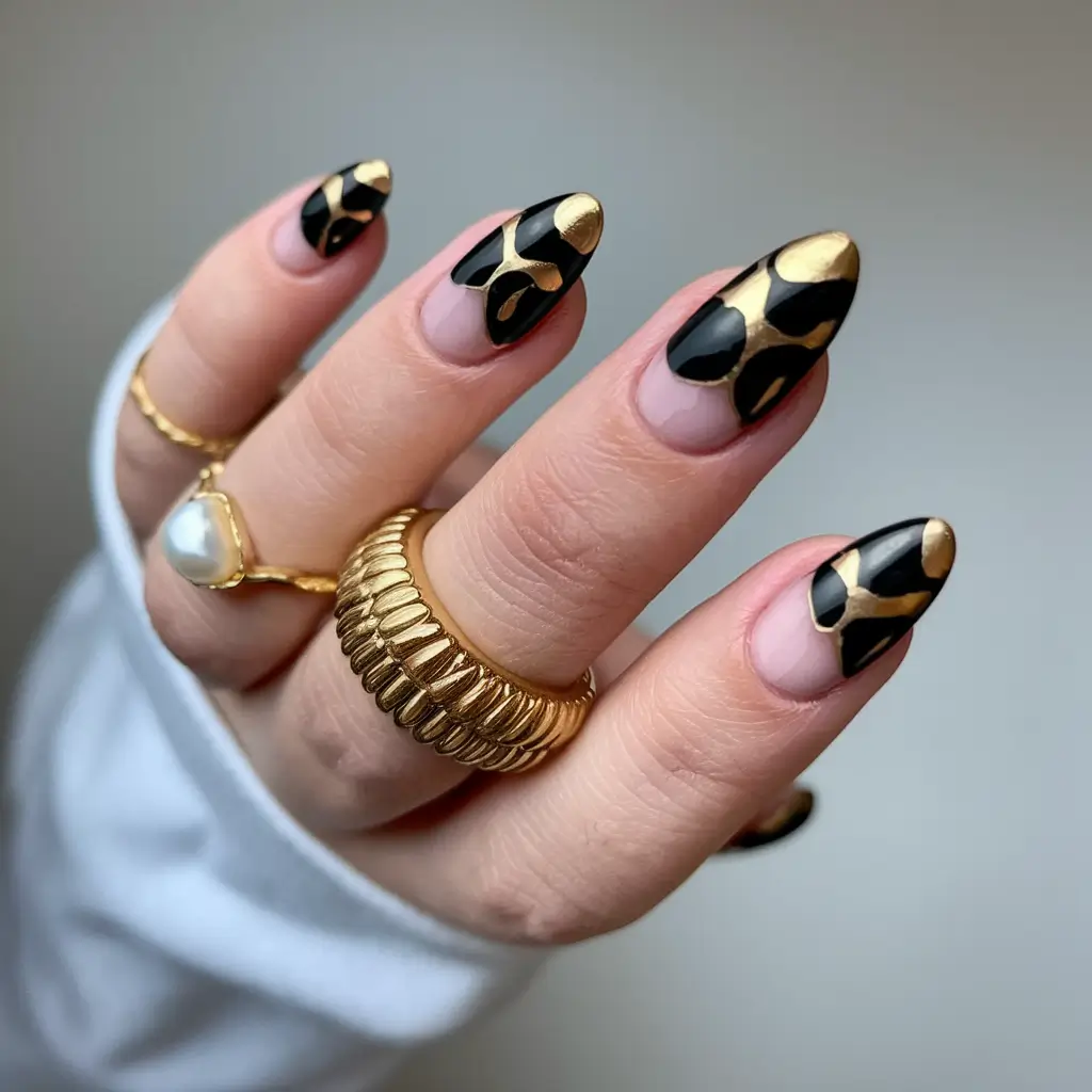 Trendy Gold Fall Nails 2025 Black and Gold Abstract Patterns