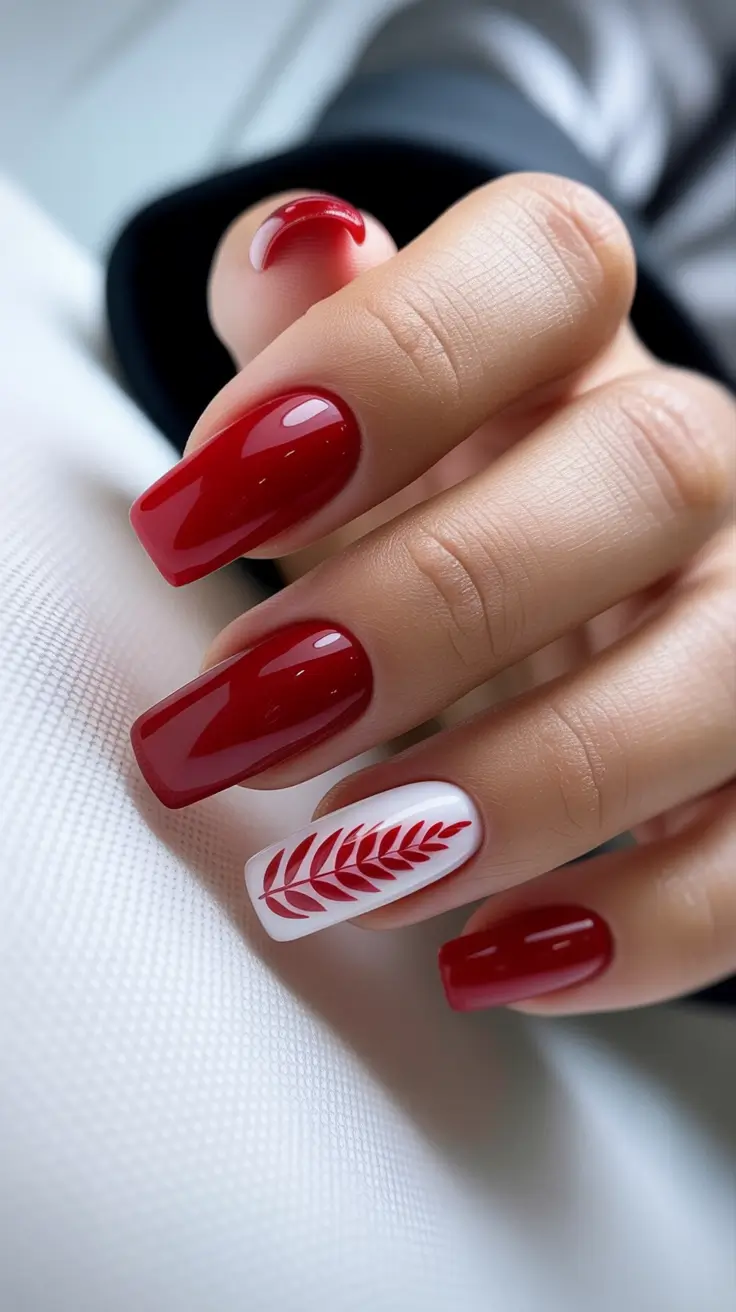 Red Nail Trends for Christmas 2025 Festive Leaf Accent