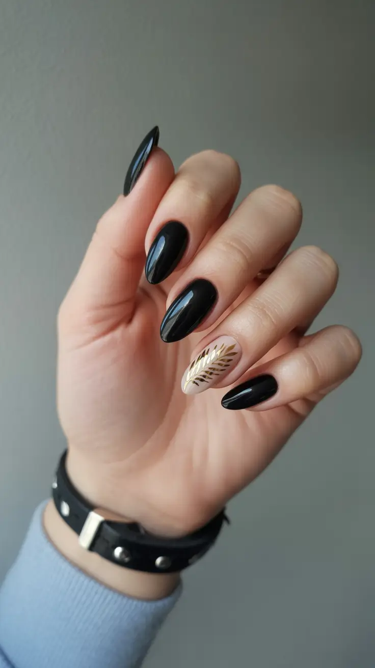 Trendy Black Nail Ideas for Christmas 2025 Golden Leaf Accent