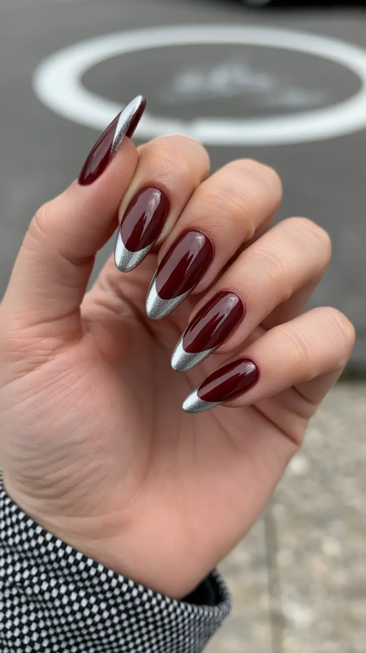 modern nail design 2026 Metal-Dipped Burgundy Almonds