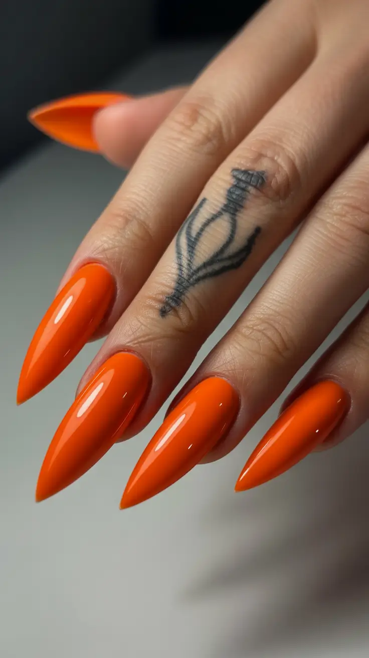stiletto nail designs 2026 Vibrant Tangerine Stilettos With Ultra-Gloss Shine