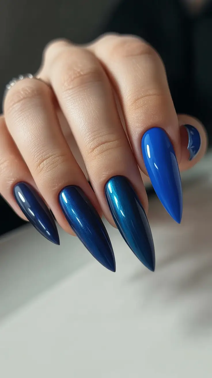 stiletto nail designs 2026 Midnight-to-Cobalt Blue Gradient With Metallic Depth
