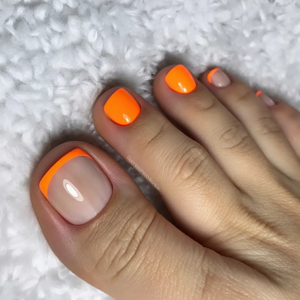 trending pedicure colors 2026 Neon Tangerine French Tip for Trendy Summer Contrast