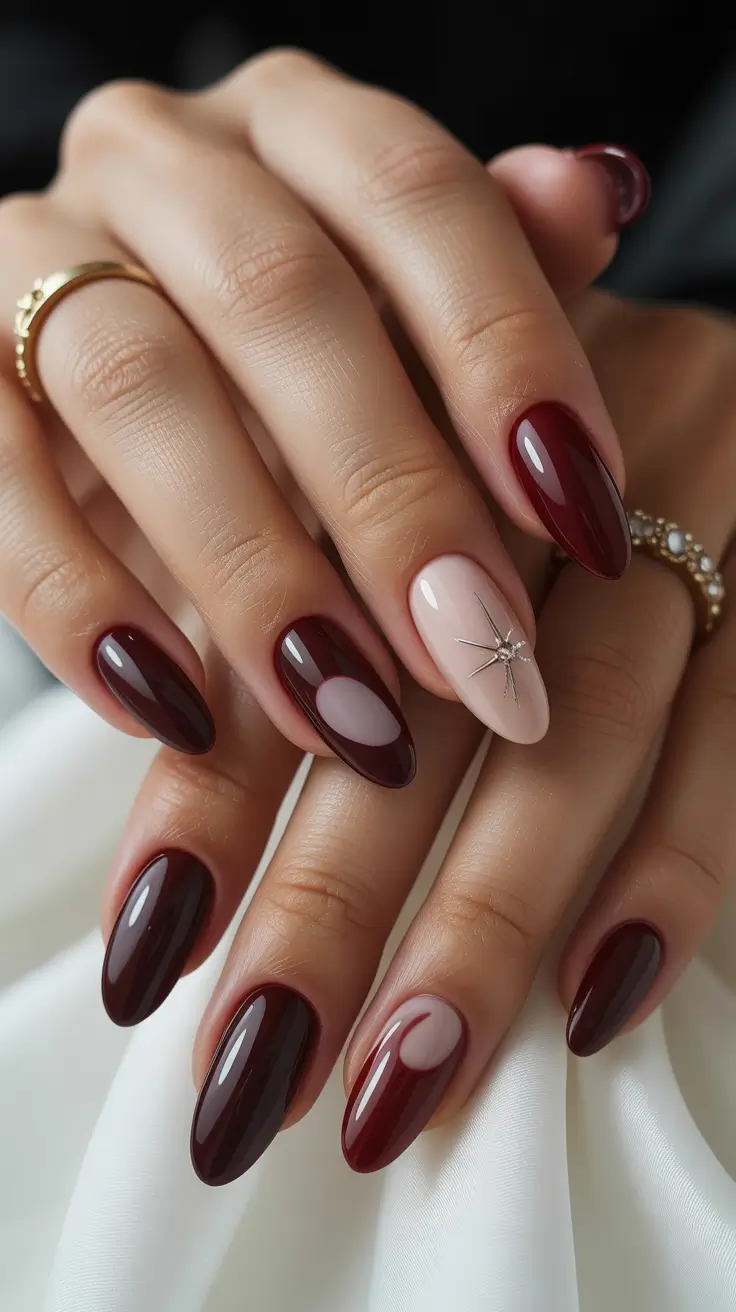 trendy acrylic nails 2026 Wine Red Almond Nails with Neutral Accent Burst
