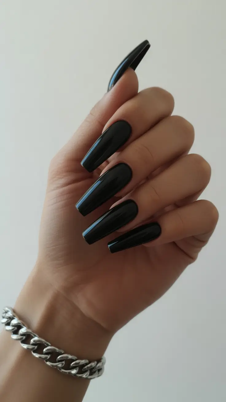 simple classy spring nails 2026 Glossy Almond Black Drama That Feels Surprisingly Light