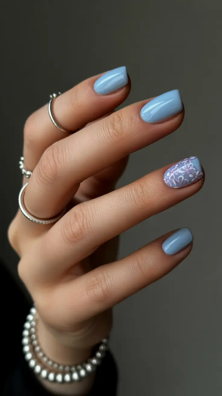 simple classy spring nails 2026 Almond Blue with a Whisper of Floral Detail