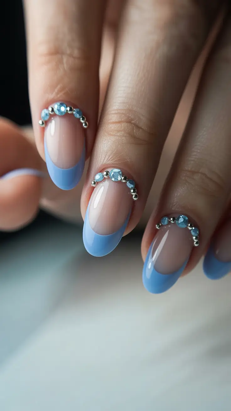 beach spring vacation nails 2026 Sky Blue Embellished French Almond Nails with Coastal Glam
