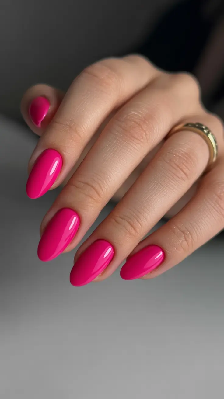 best pink spring nails 2026 Glossy Fuchsia Almond Nails That Instantly Brighten Spring