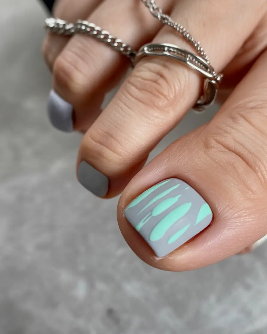 minimalist spring toe nails 2026 Cool Grey Base with Mint Graphic Flow