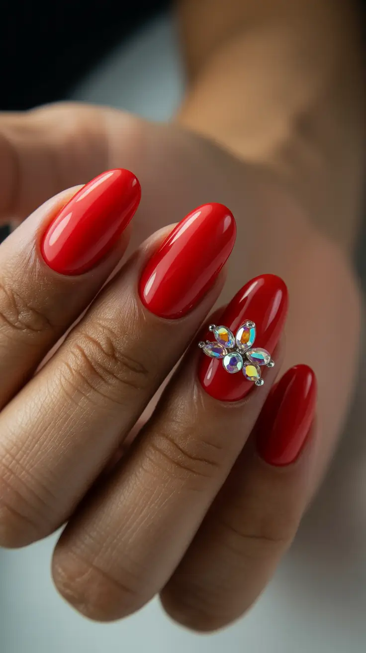 sophisticated spring oval nails 2026 Glossy Cherry Statement with Jewel Accent