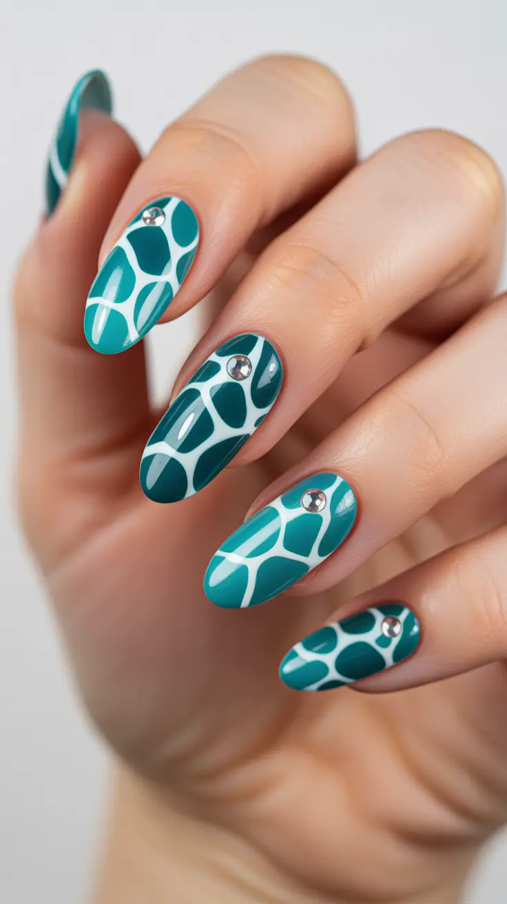 sophisticated spring oval nails 2026 Teal Mosaic Geometry with Crystal Highlights