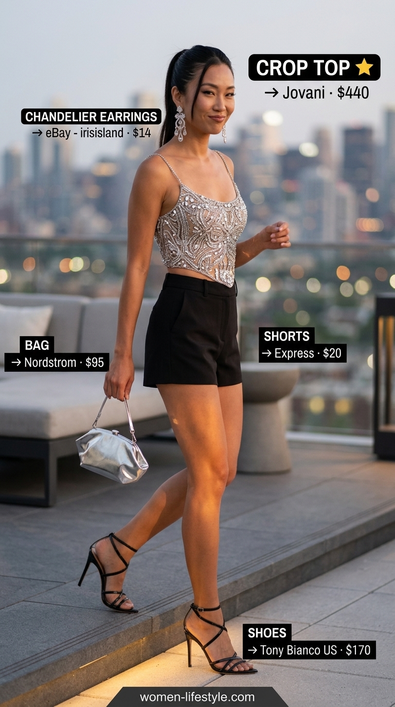 Silver sequin corset crop top with black tailored shorts for glamorous party outfits 2026.