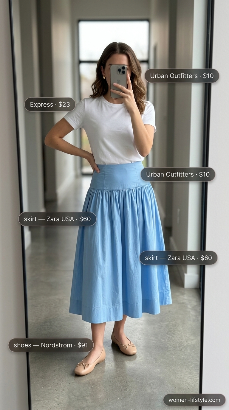 Minimalist NYC Summer Outfits 2026: Picnic Perfect Look Minimalist NYC summer outfit for women 2026: Sky blue midi skirt, white tee, straw bag, nude flats.