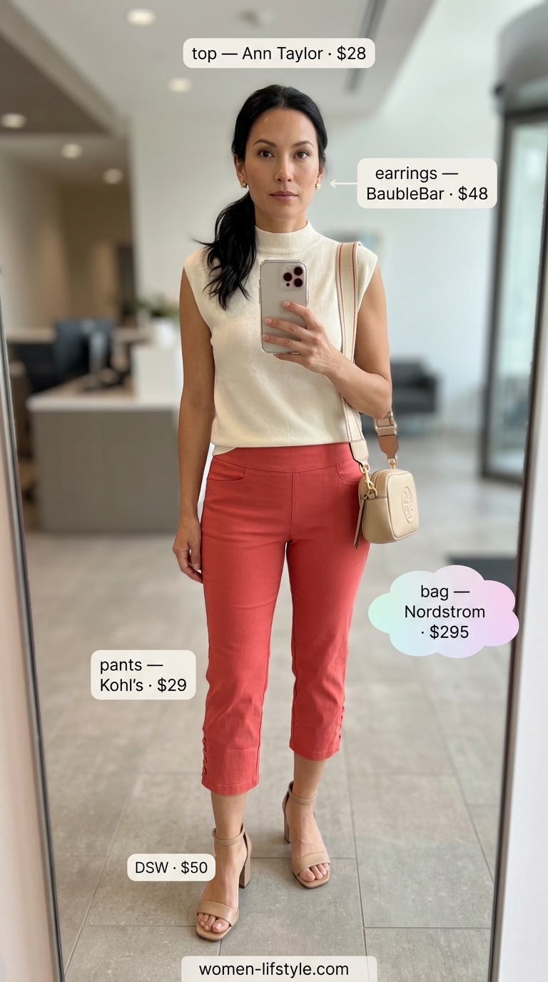 Vibrant coral pants outfit: coral cropped pants, cream mock neck top, and nude sandals for a creative office.