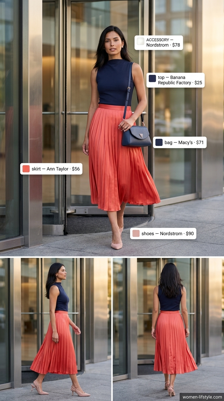 Coral accordion skirt, navy knit top, and nude pumps for an office presentation.