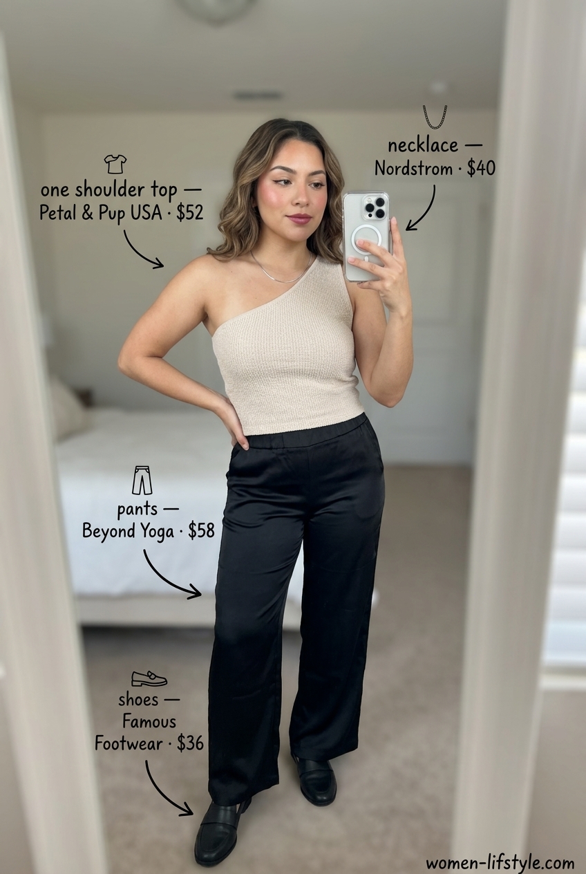 Chic travel one shoulder top outfit for women 2026: beige knit, black wide-leg pants, black loafers, silver necklace.