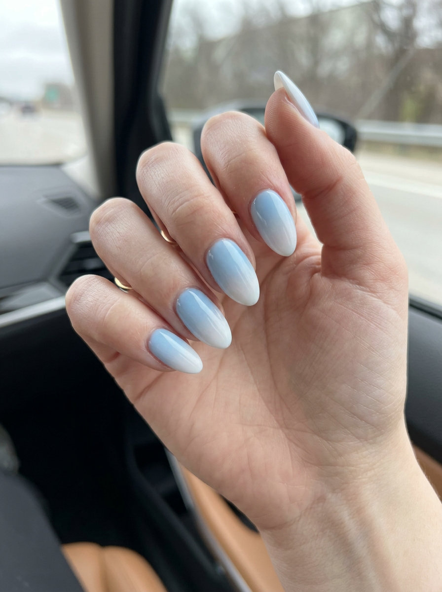 Baby blue airbrush almond nails 2026 for fair skin, perfect for summer vacation and casual days.