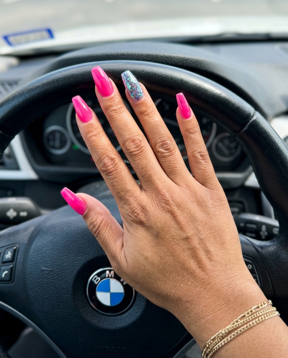 Hot pink nails with iridescent glitter accent for parties. Colourful summer nails 2026.