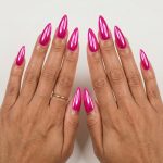 Hot pink chrome stiletto nails for neon summer nails 2026. Sultry, glamorous, daring party look.