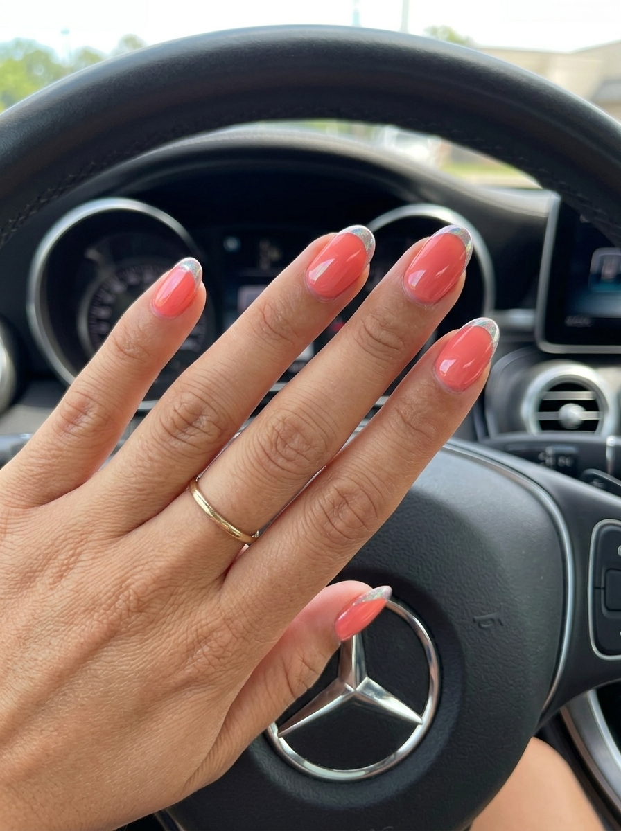 Short Oval Summer Nails 2026: Coral Chrome French Tip Short oval summer nails 2026: Coral blush with edgy silver chrome micro French tip for vacation.
