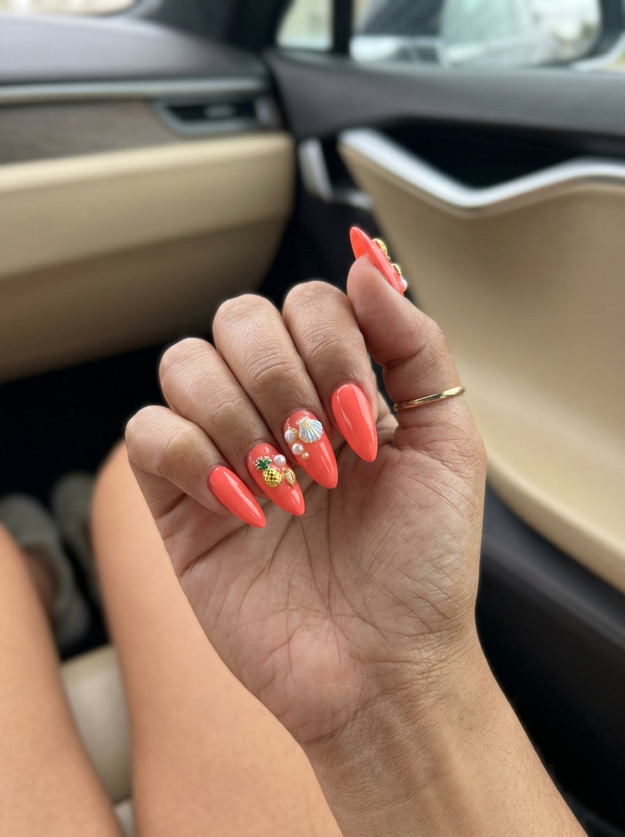 Coral Charm Stiletto Summer Nails 2026 Vivid coral stiletto summer nails 2026 with 3D fruit and shell charms. Perfect for vacation.