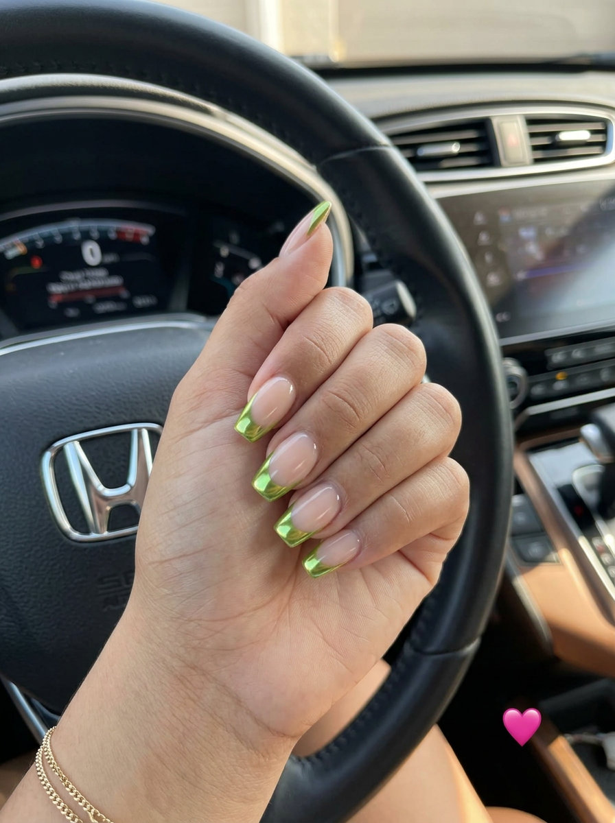 Sheer nude nails with bright lime green chrome French tips for a bold party look. Summer colorful nails designs 2026.