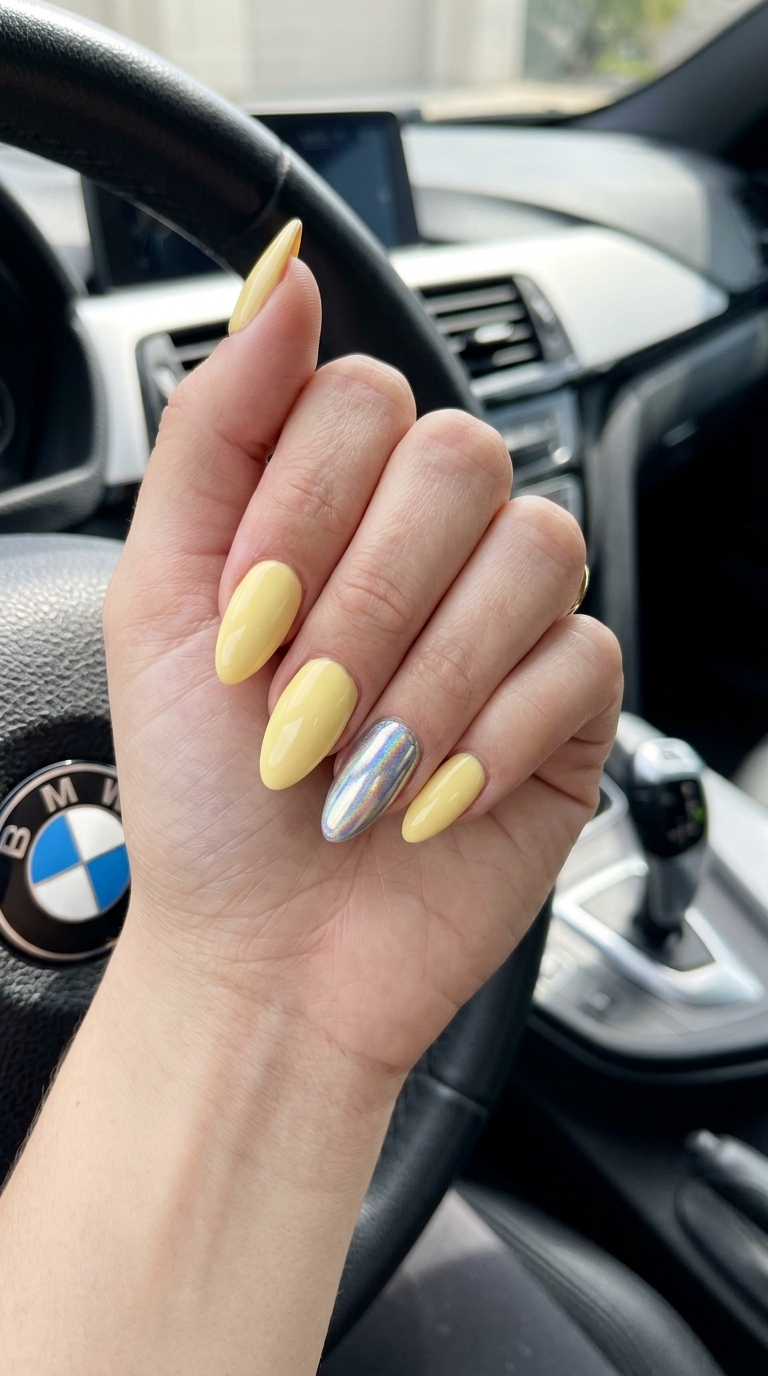 Butter yellow chrome pop stiletto nails for parties and date nights, summer dip nails 2026.