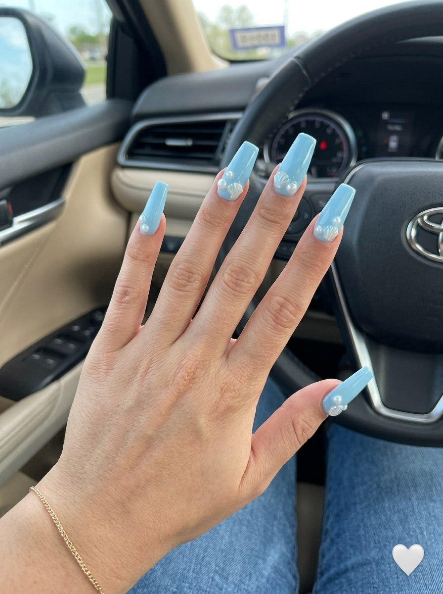 Ocean Charm Flare nails: sky blue with pearl & shell charms for playful summer dip nails 2026.