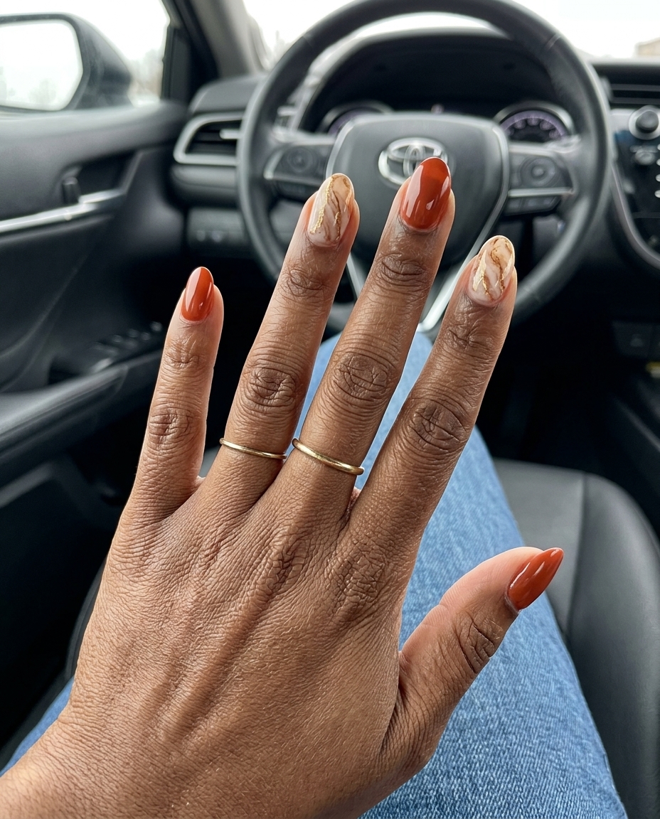 Terracotta Marble Accent nails for summer nails for dark skin 2026. Deep terracotta, cream, gold marble art.