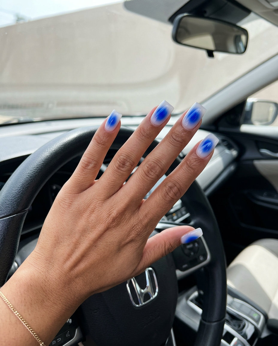 Cobalt Blue Aura Square Nails 2026 Cobalt blue aura square nails for summer 2026. Futuristic, artistic design with a neutral base.