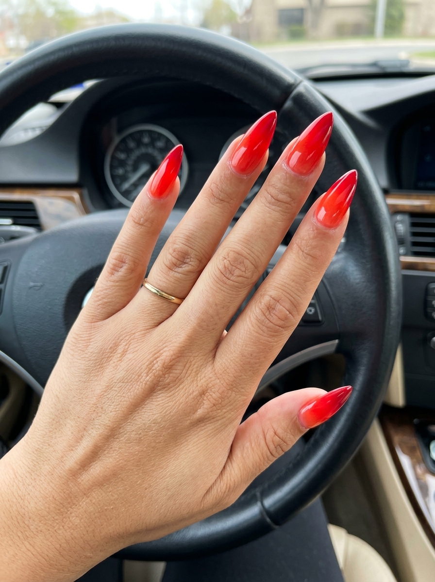 Fiery red to scarlet ombre stiletto nails for night out or summer party, bold and glamorous 2026.