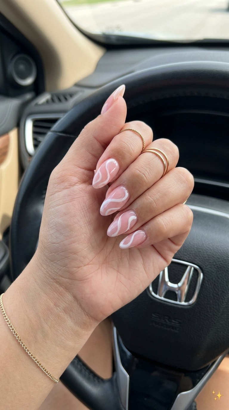 Peach & White Swirl Almond Nails 2026 | Date Night Style Peach and white abstract swirls on almond nails for summer vibes nails 2026. Romantic & artistic.