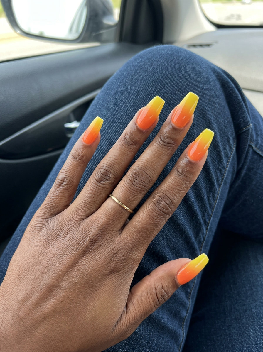 Tropical Sunset Ombre Nails 2026: Vibrant Vacation Style Tropical Sunset Ombre Coffin nails: Opaque tangerine orange to lemon yellow gradient for summer vibes nails 2026.