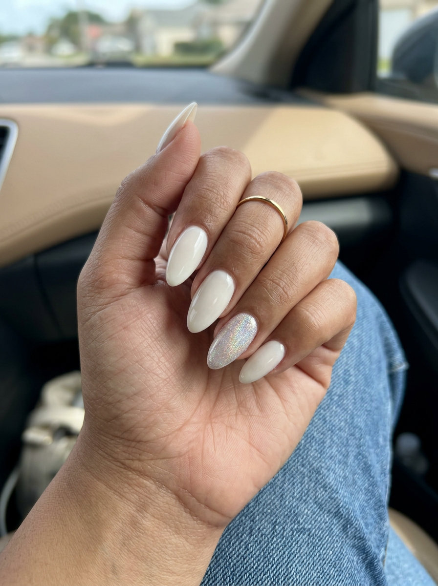 Milky Almond Shimmer Accent nails: sophisticated opaque milky white with iridescent shimmer on accent for summer wedding nails 2026.