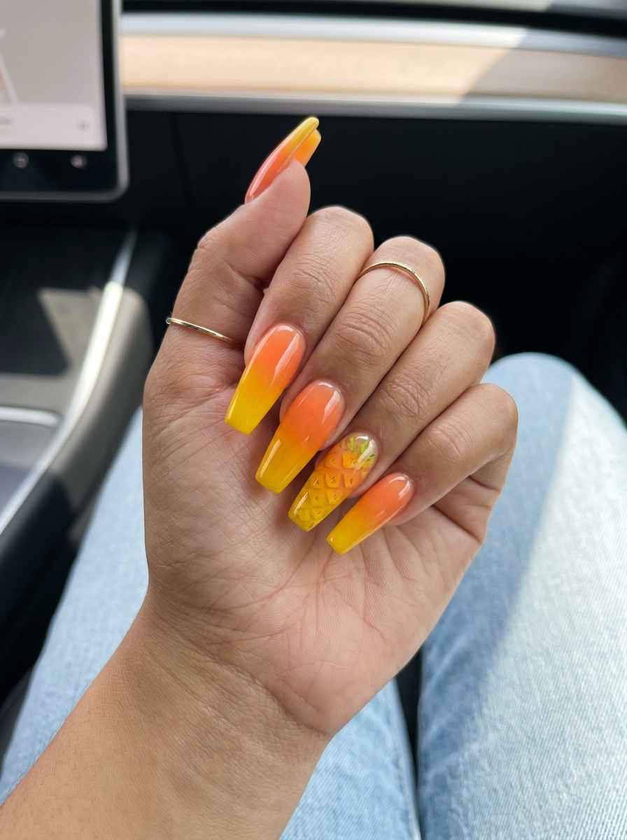 Jelly Pineapple Ombre Stilettos 2026 Playful jelly pineapple ombre stiletto nails in yellow and orange for summer parties. Tropical nail designs 2026.