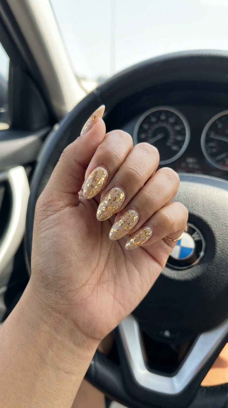 Golden Hour Foil Almonds vacation nails summer 2026. Glamorous resort evening event style.