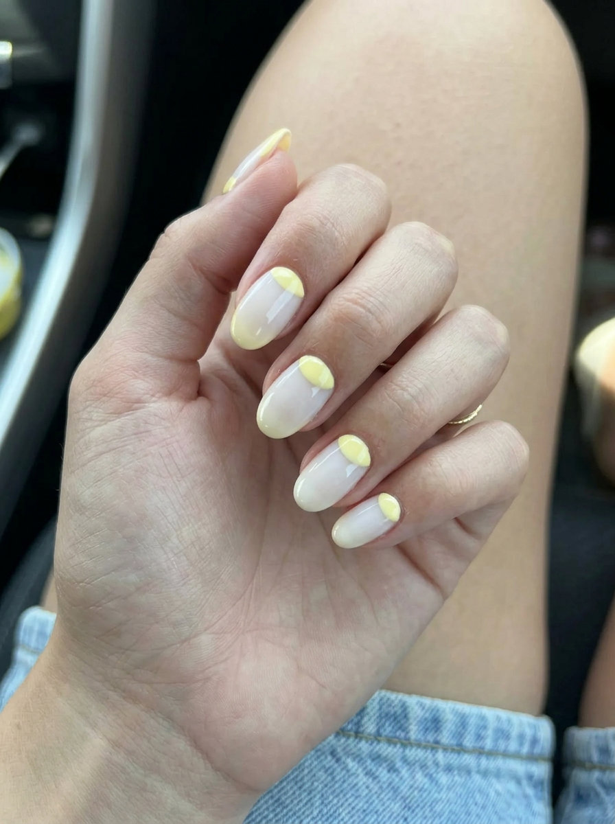 Butter Yellow Reverse French nails: yellow half-moon with nude tip for work and business casual 2026.
