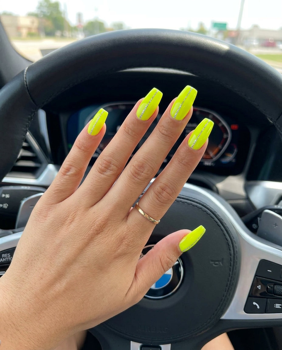 Neon yellow glitter lines nails for festivals 2026. Edgy coffin nails with bold graphic contrast.