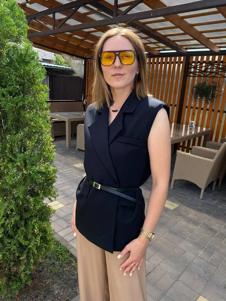fall outfits with vests 2026 Sharp Black Vest Styling with Neutral Trousers
