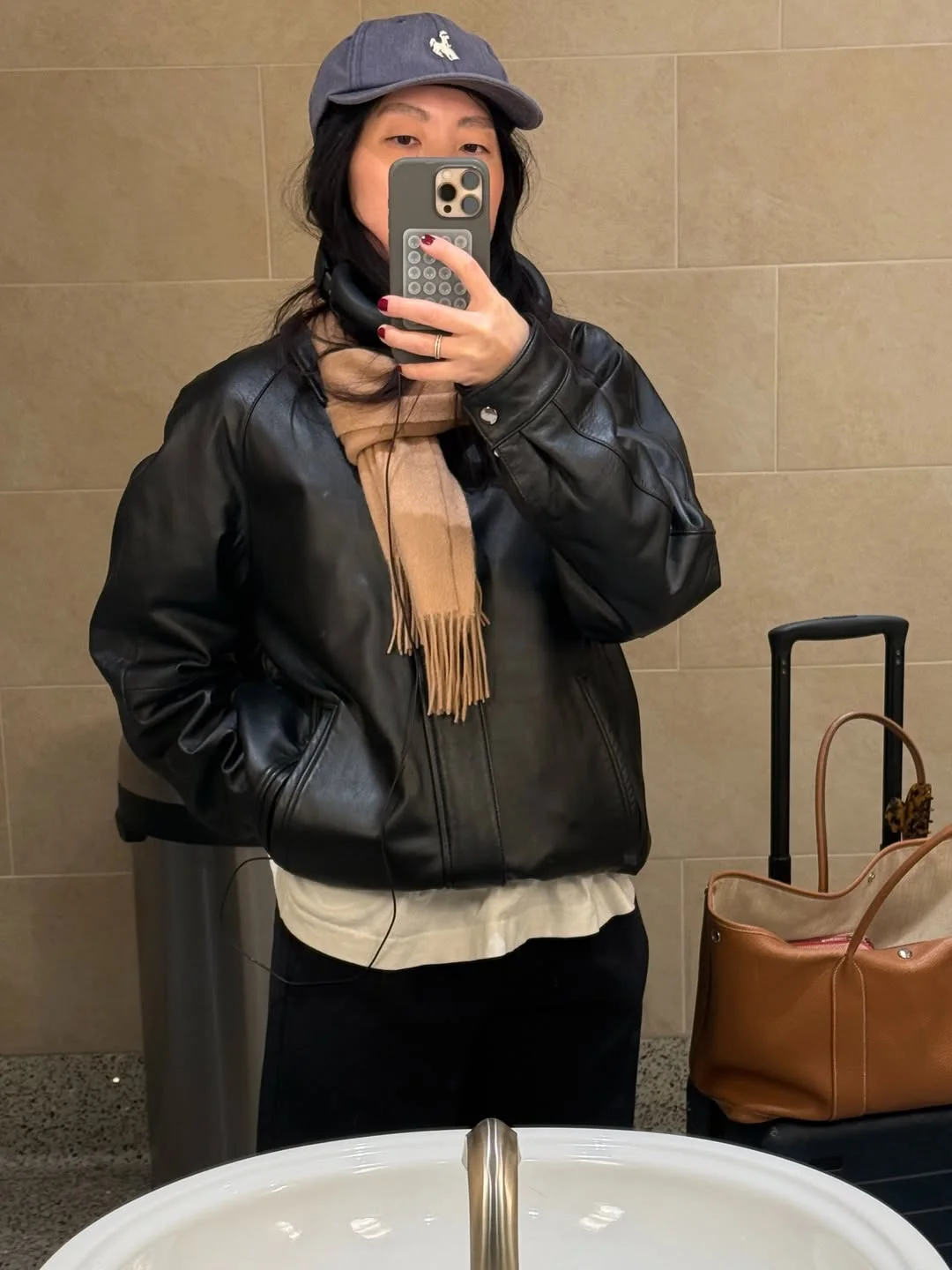 fall travel wardrobe for women 2026 The Oversized Leather Jacket That Travels Better Than You